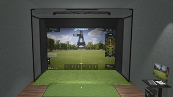 A view of a golf game on a projector screen in a golf simulator 